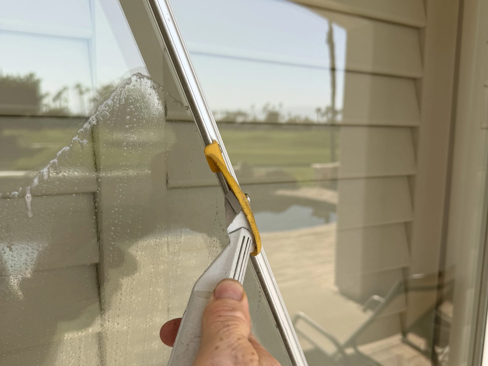Squeegeeing a patio slider to a streak-free finish